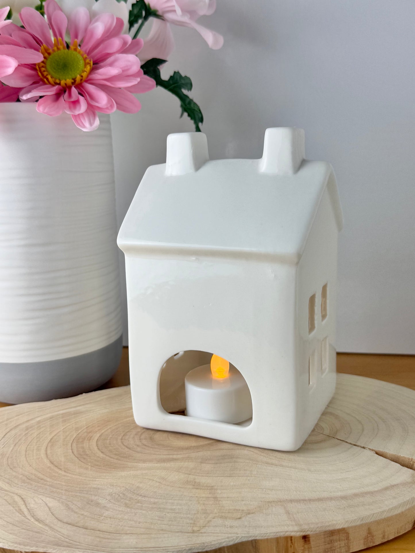 White ceramic candle house
