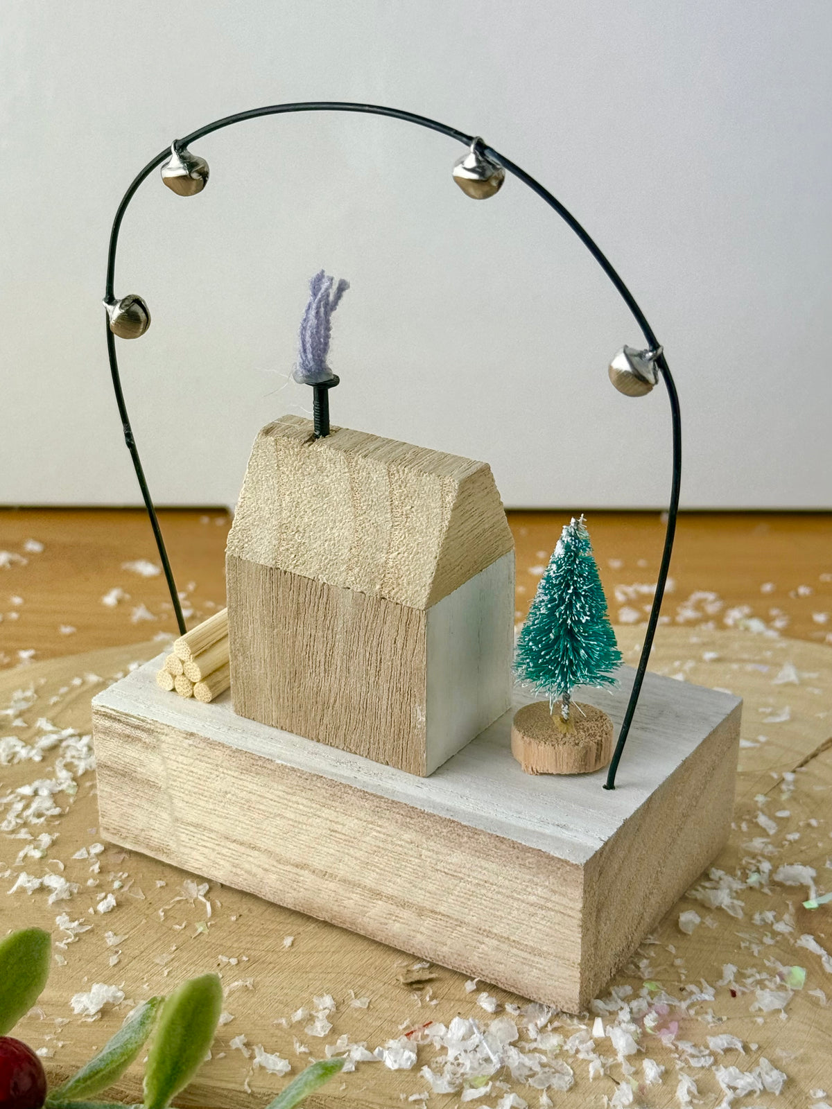 Wooden Noel House with bell arch