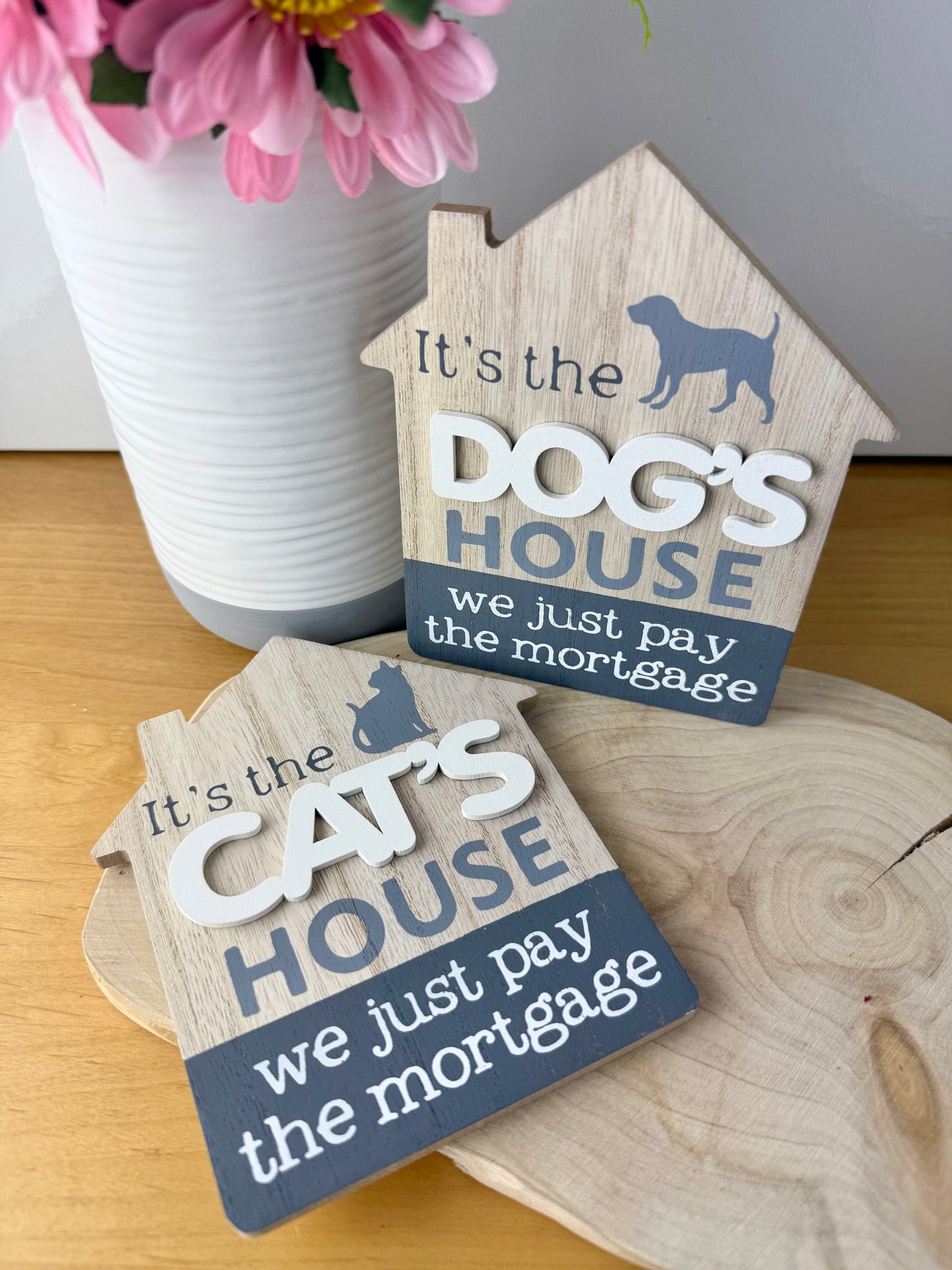 It's the Cats House we just pay the mortgage wooden sign
