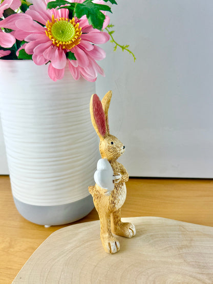 Jasper Rabbit holding a white heart