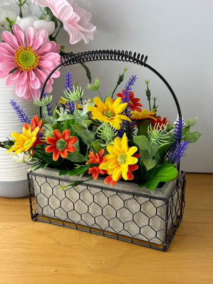 Yellow & orange Forever Flowers in a Wire Basket