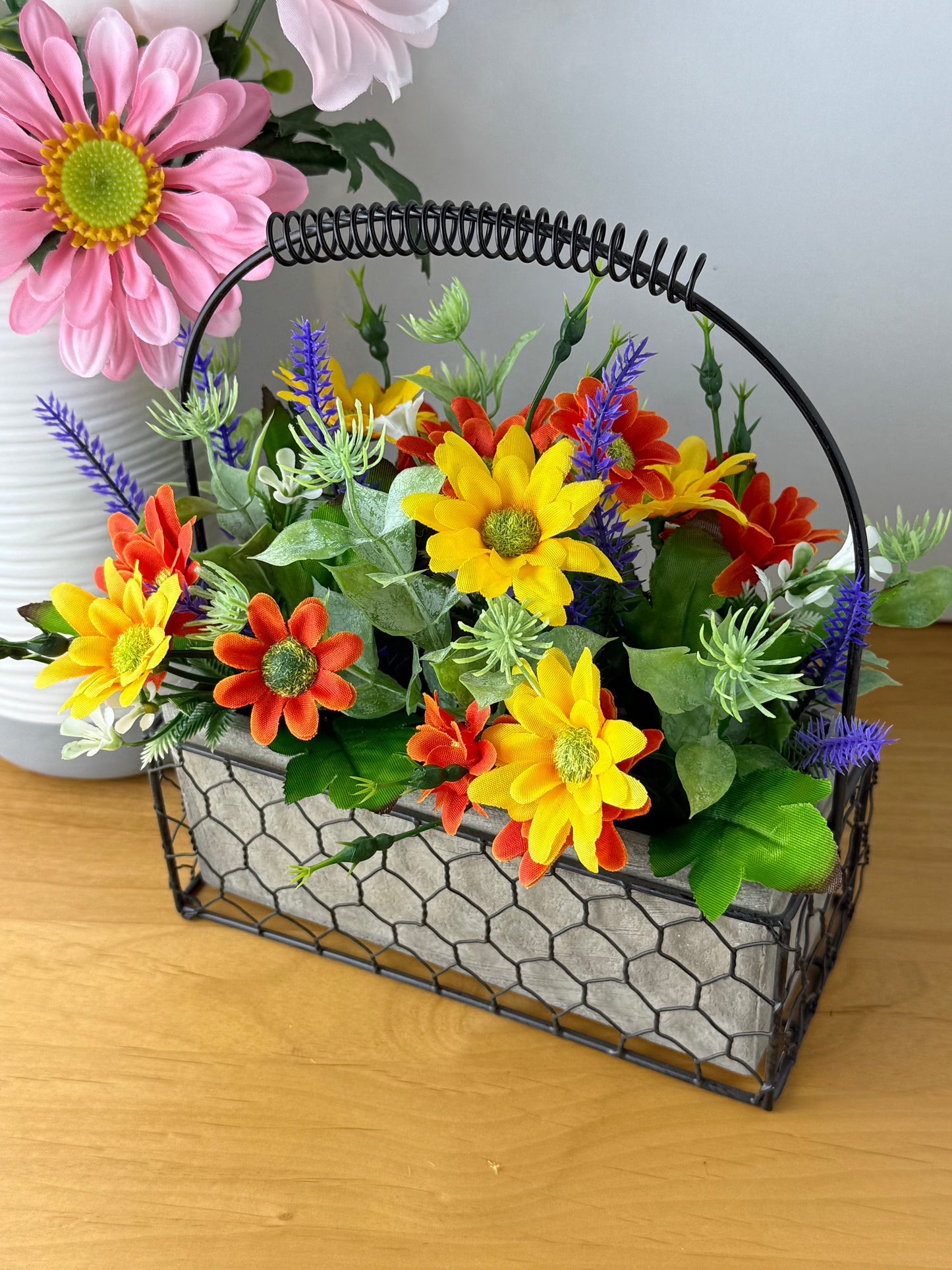 Yellow & orange Forever Flowers in a Wire Basket