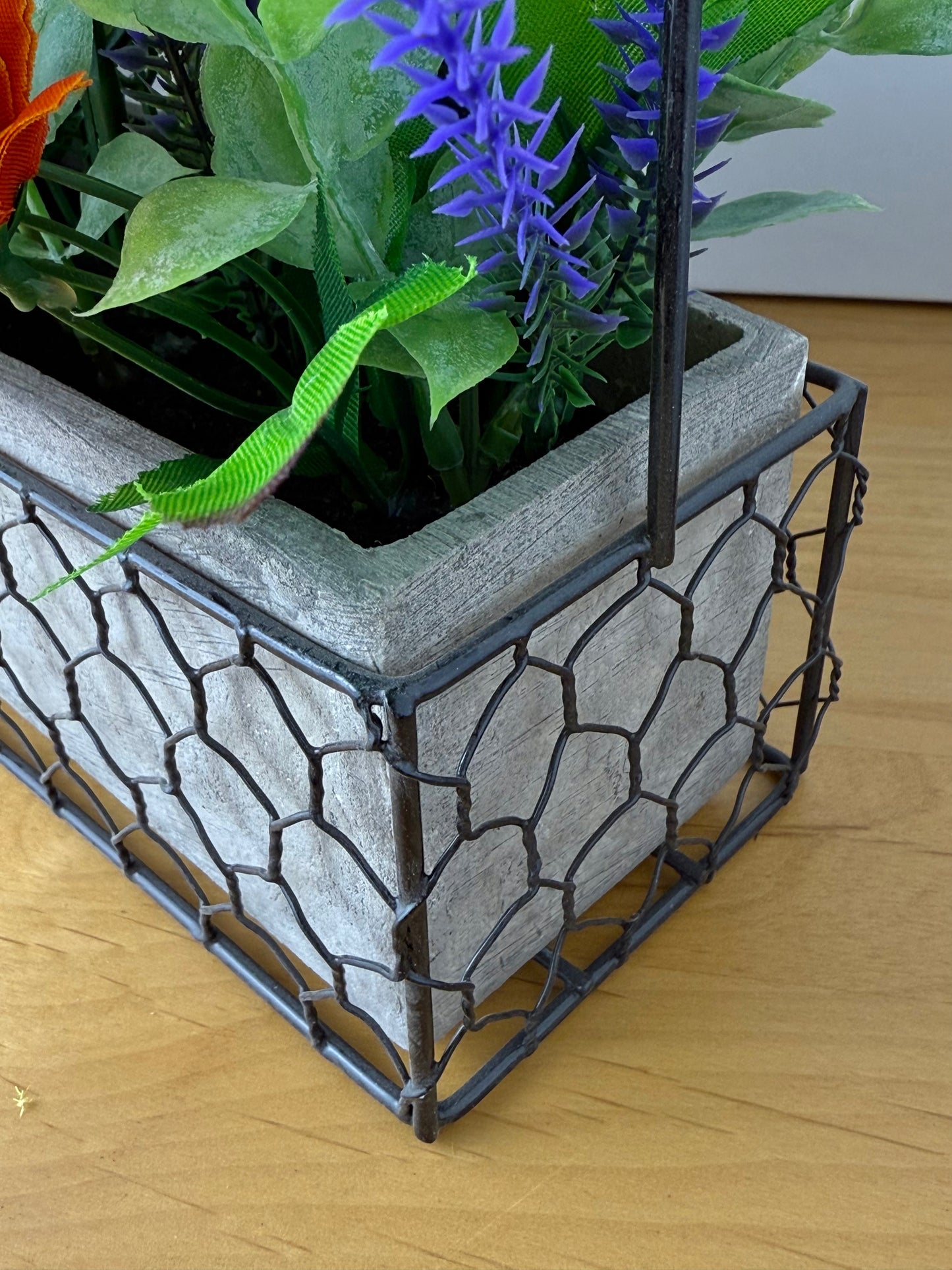 Yellow & orange Forever Flowers in a Wire Basket