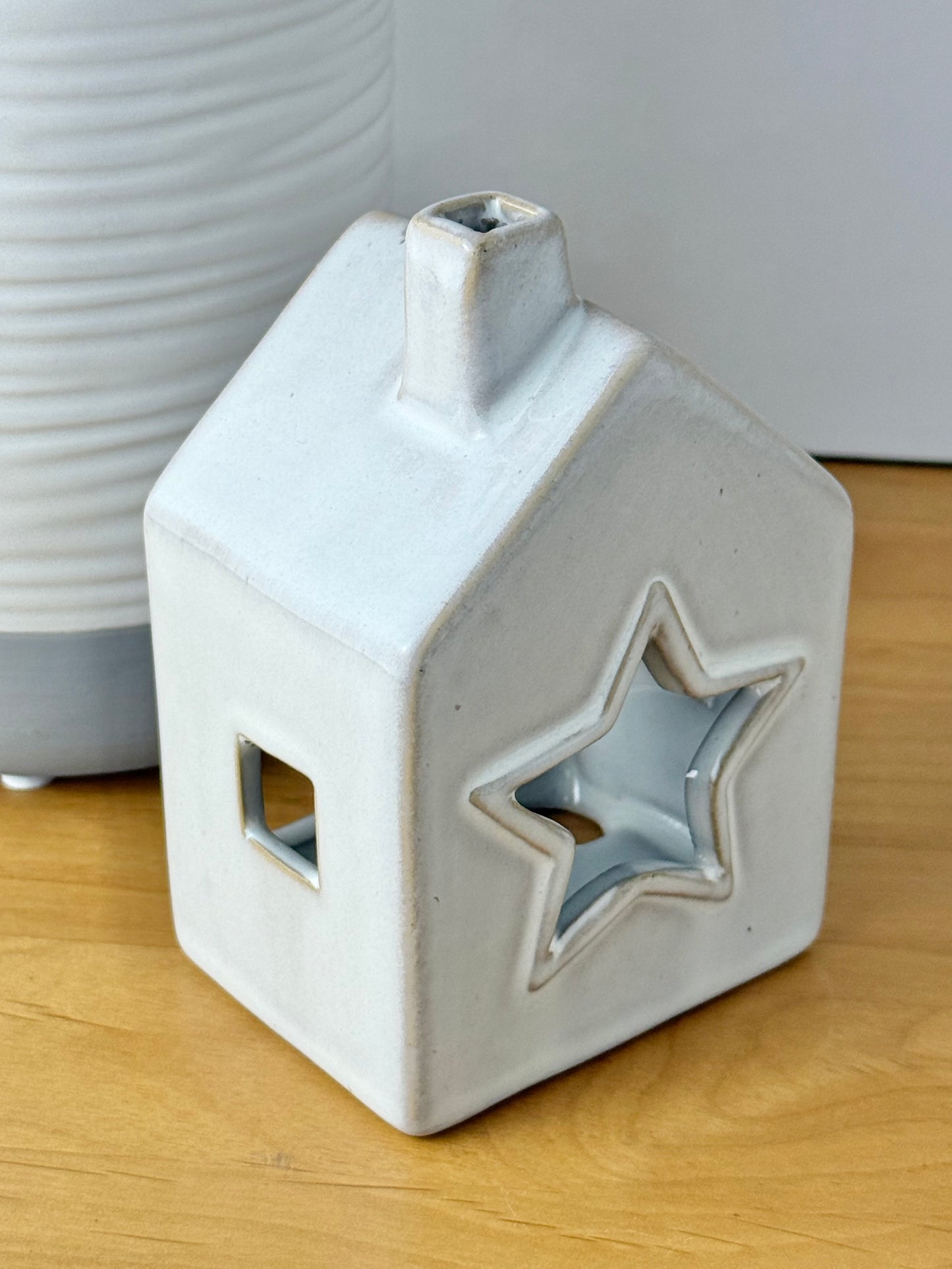 Grey glazed t-light holder - shape of house with cutout star