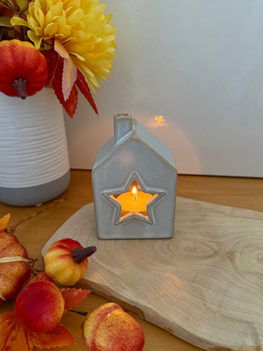 Grey glazed t-light holder - shape of house with cutout star