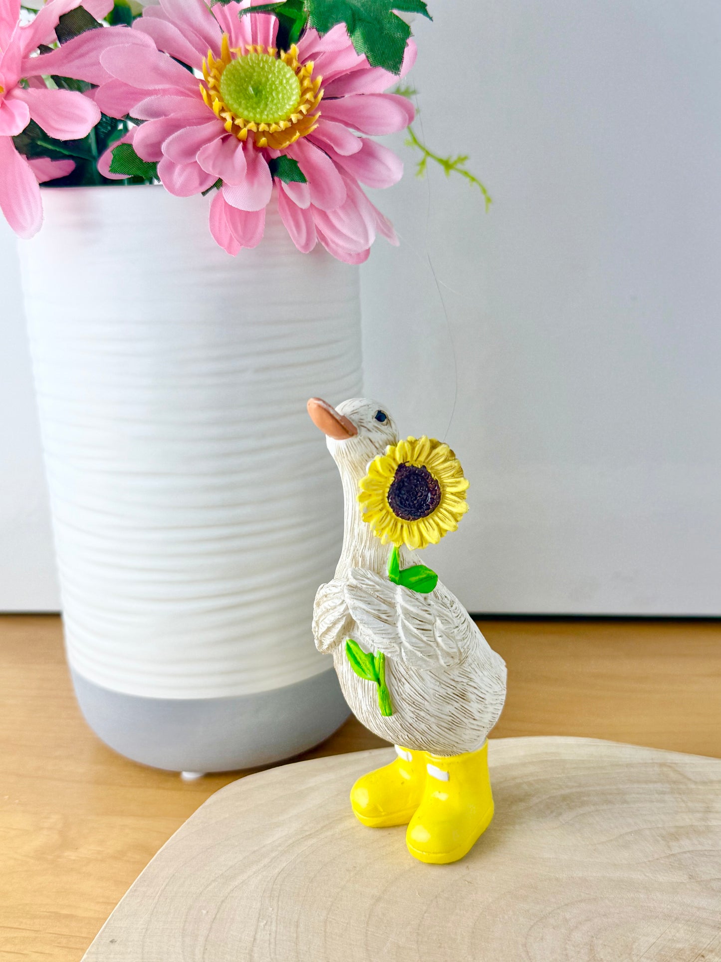 Duck wearing yellow wellington boots & sunflower