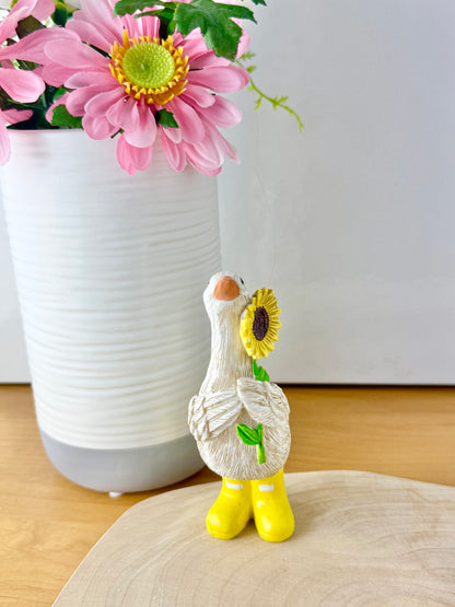 Duck wearing yellow wellington boots & sunflower