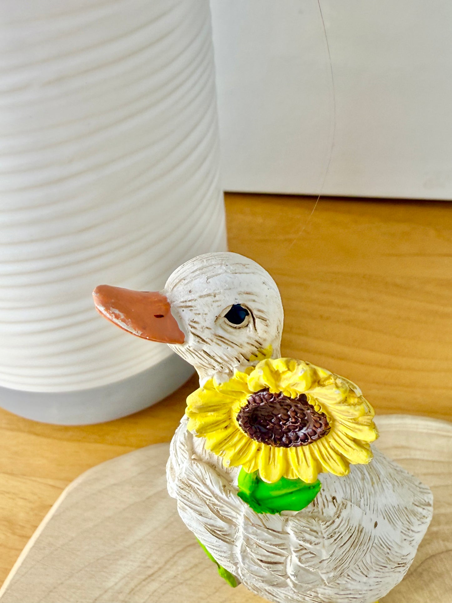 Duck wearing yellow wellington boots & sunflower