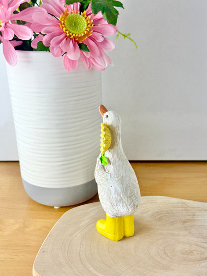 Duck wearing yellow wellington boots & sunflower