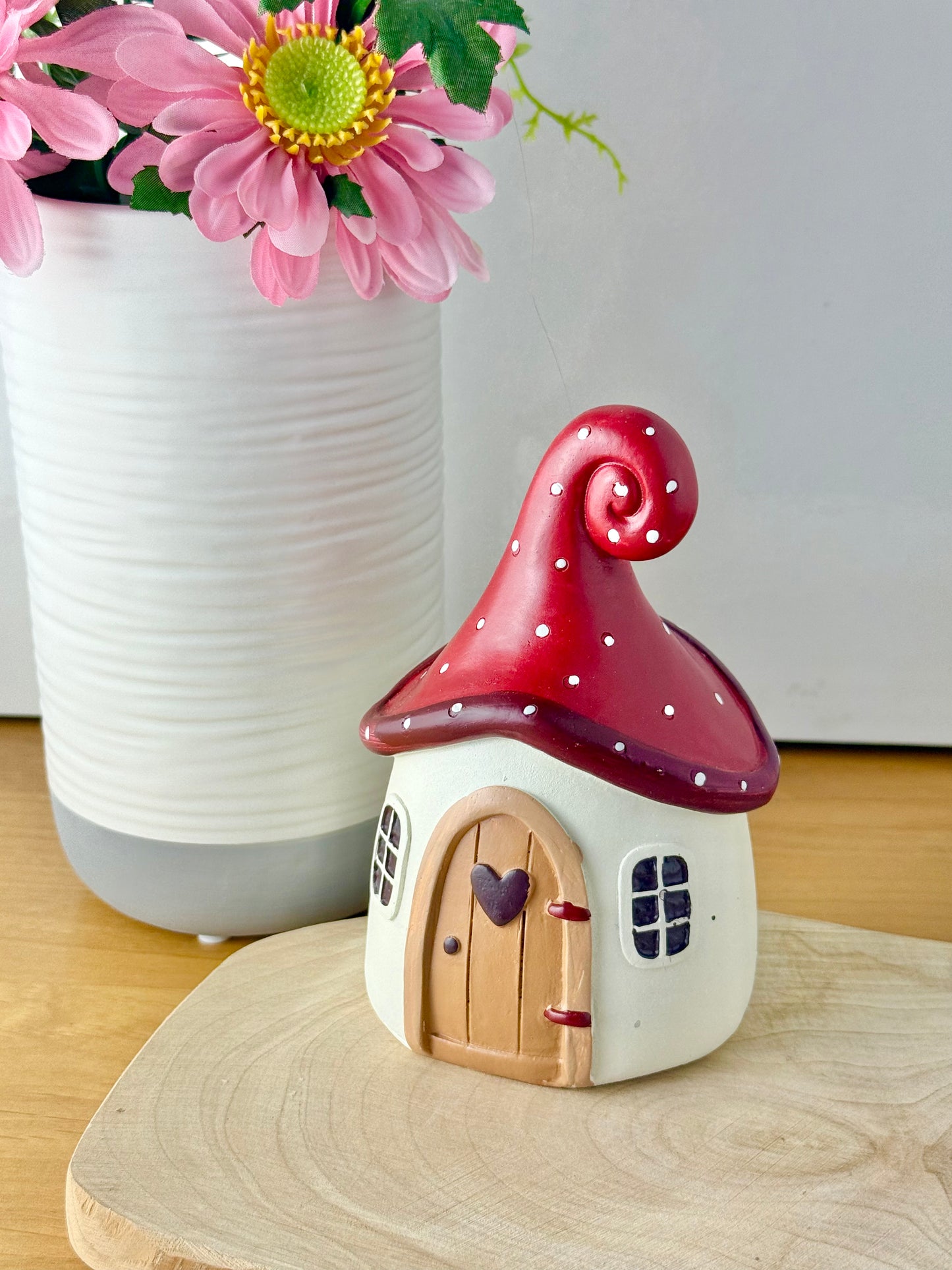 Mushroom house with red polka dot roof & heart door