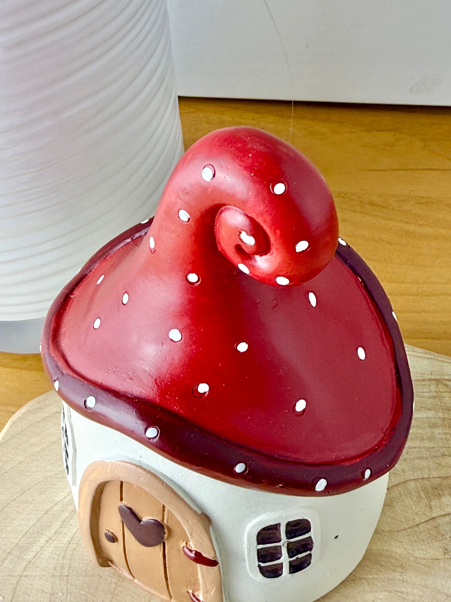 Mushroom house with red polka dot roof & heart door