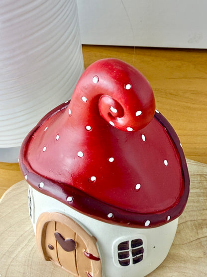 Mushroom house with red polka dot roof & heart door
