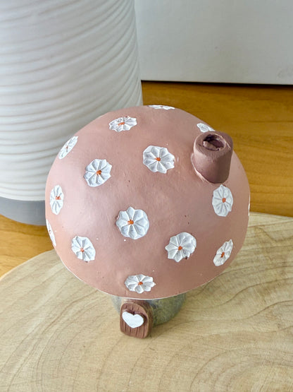 Pink daisy mushroom house