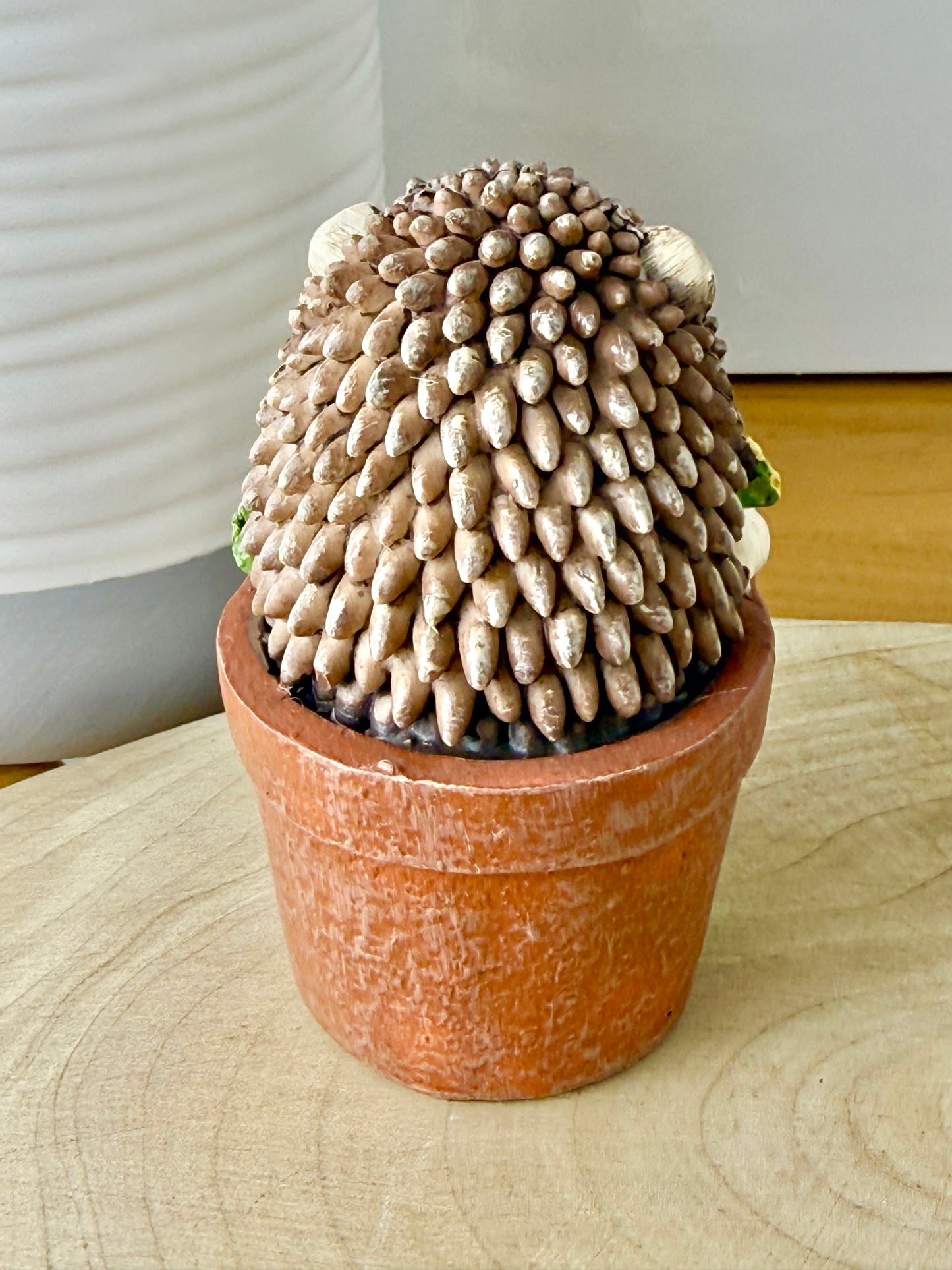 Hedgehog sat in a Plant Pot
