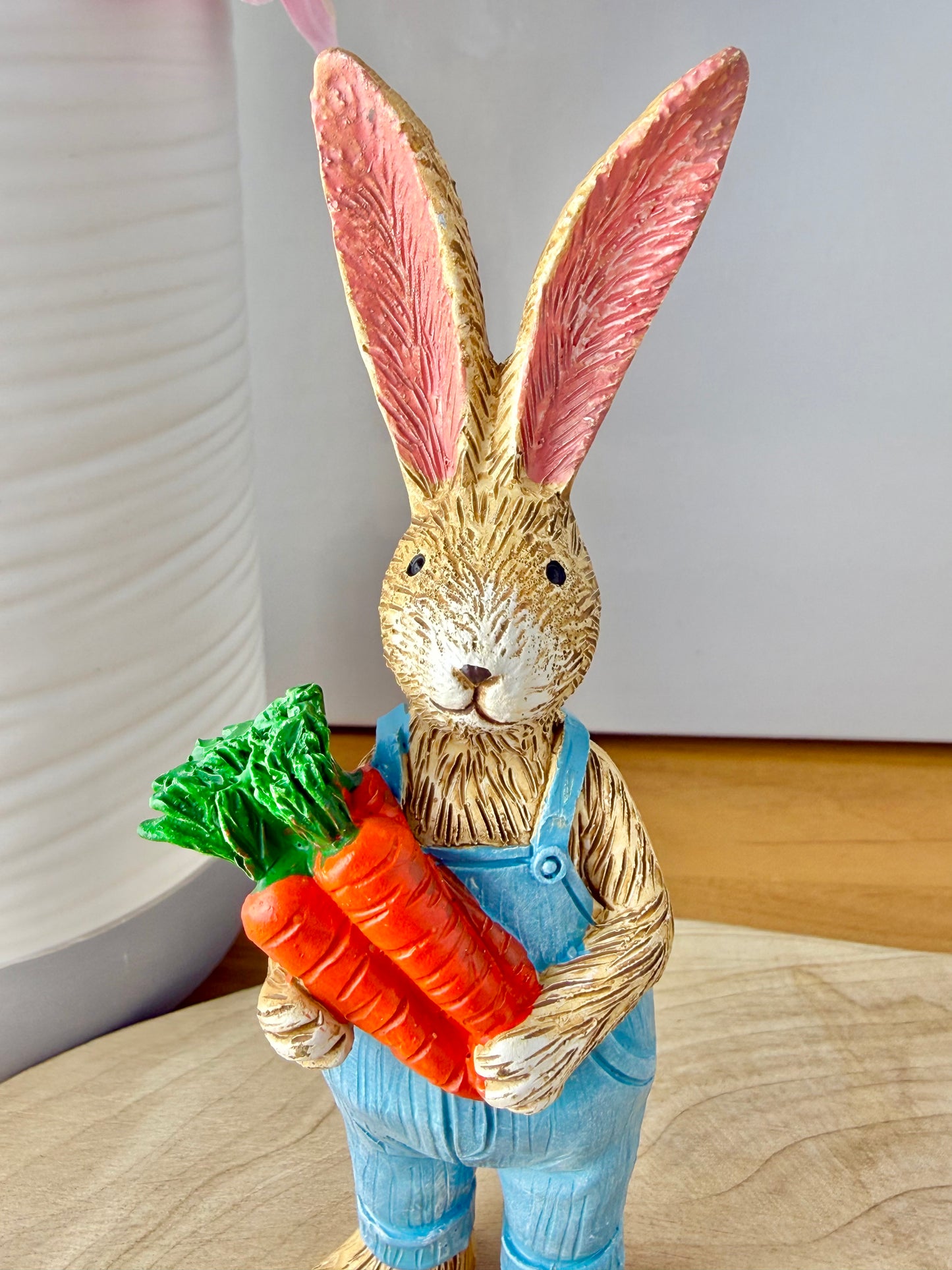 Jasper Rabbit holding a bunch of carrots