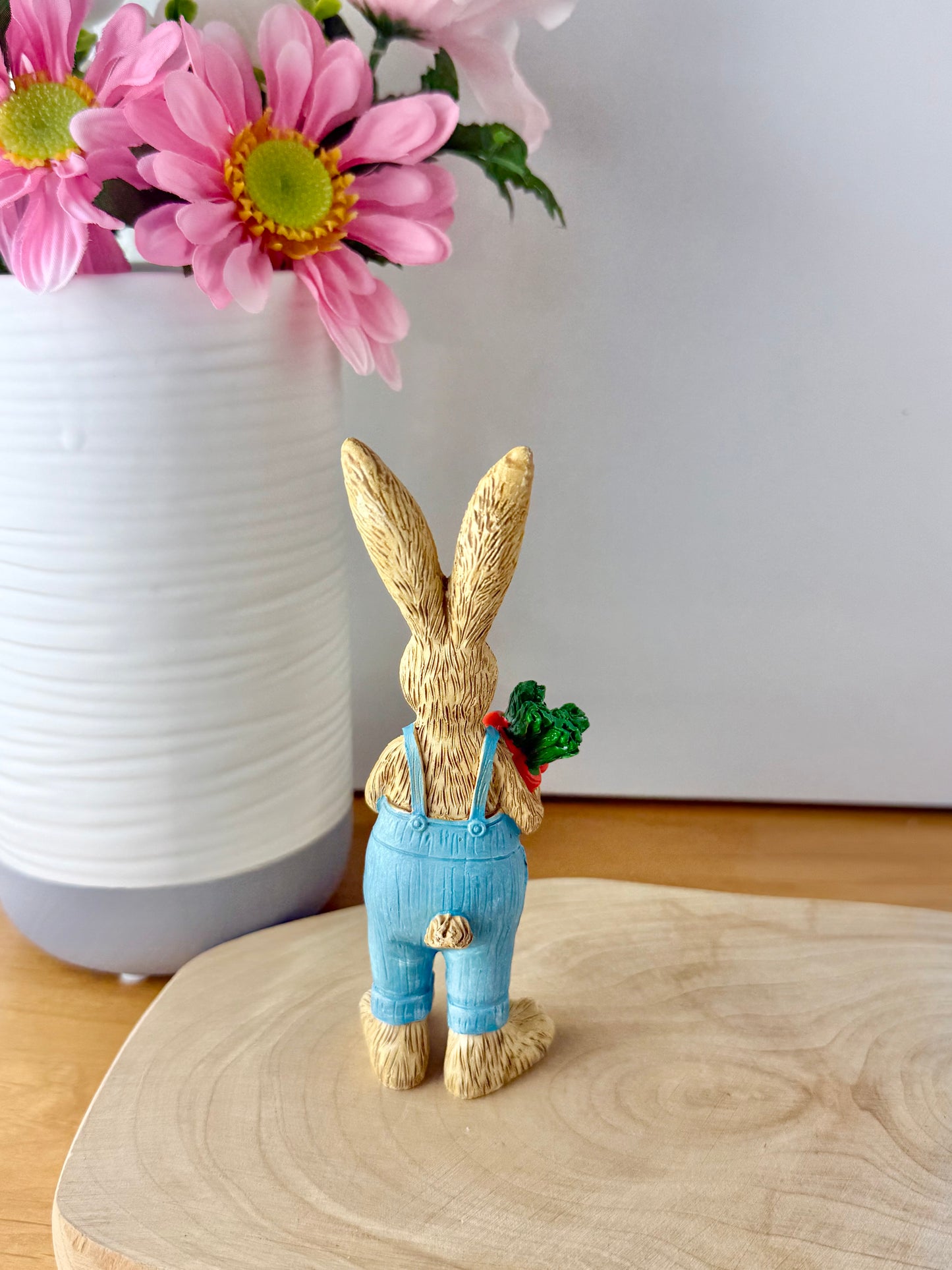 Jasper Rabbit holding a bunch of carrots