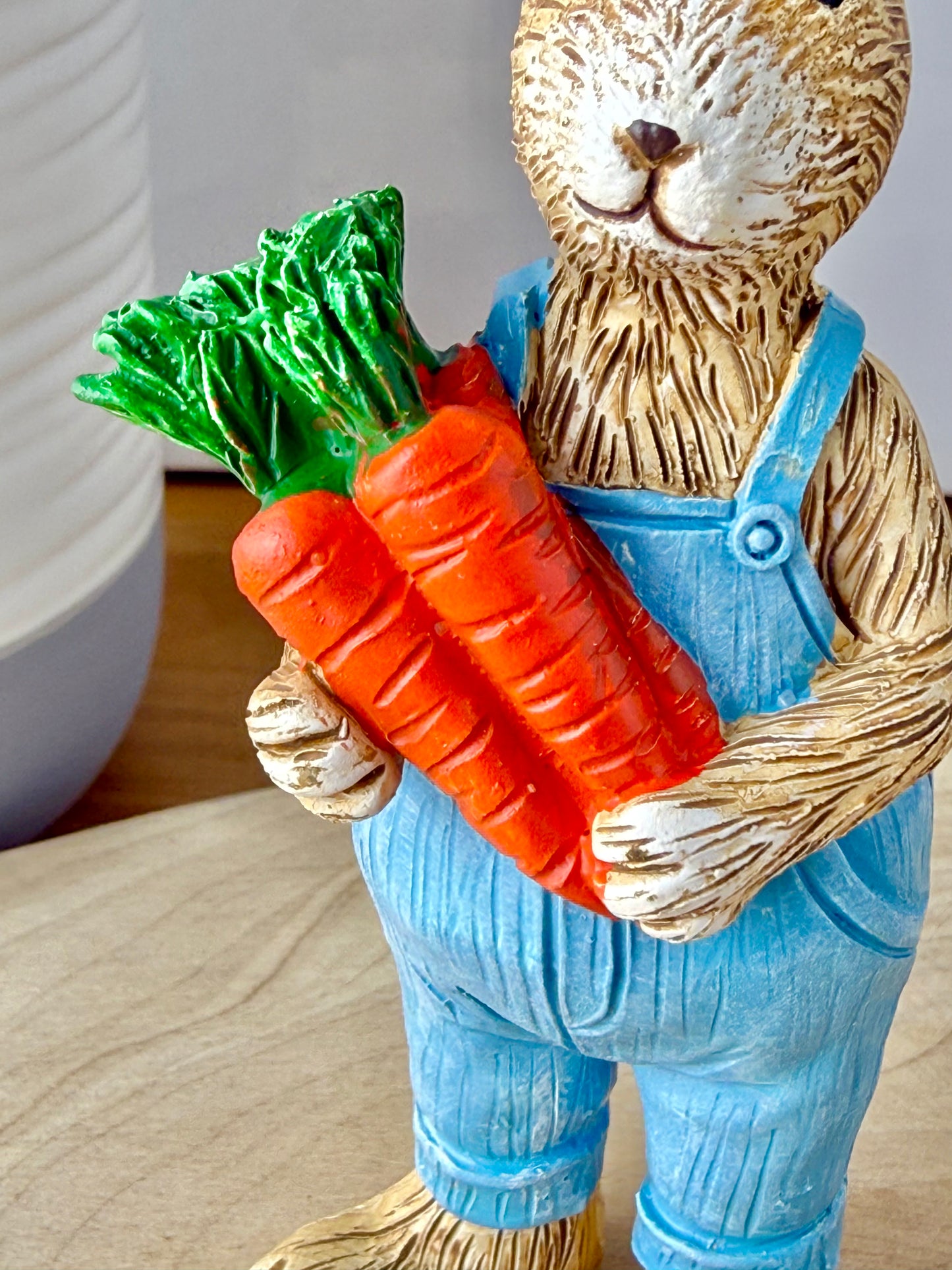 Jasper Rabbit holding a bunch of carrots