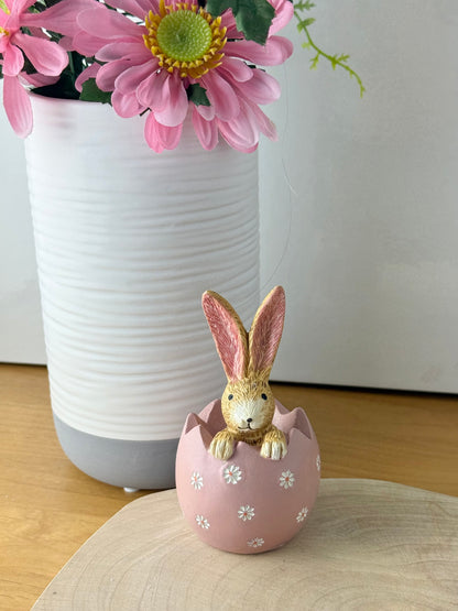Jasper Rabbit sitting inside a pink daisy egg