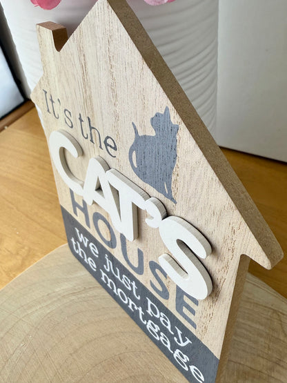 It's the Cats House we just pay the mortgage wooden sign