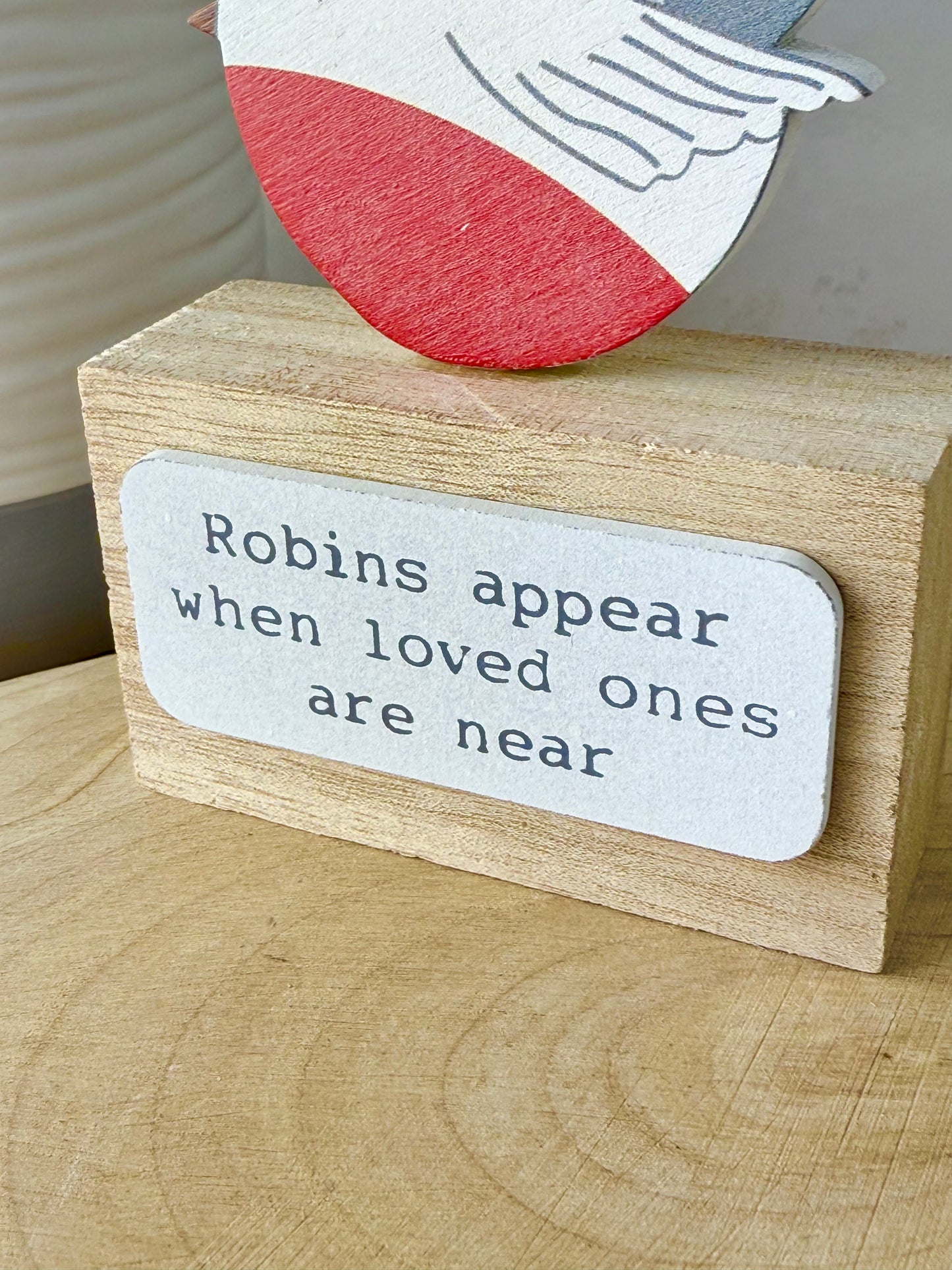 Robins appear wooden block sign