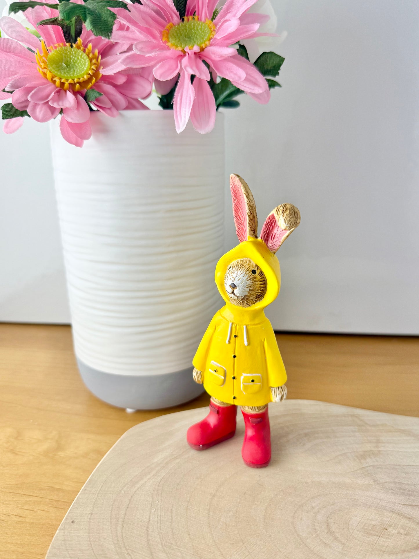 Jasper Rabbit dressed for the rain in a yellow raincoat & red wellies