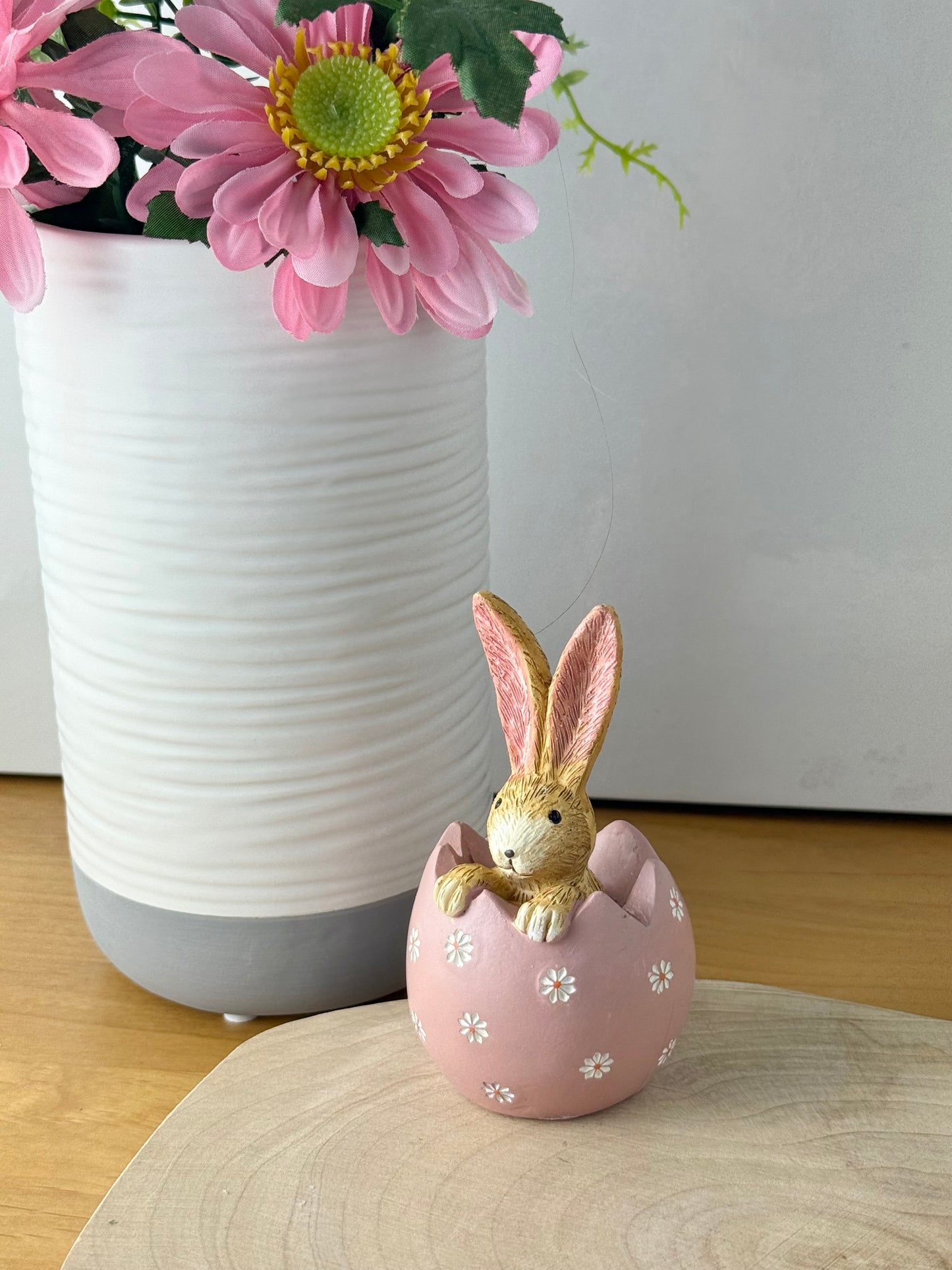 Jasper Rabbit sitting inside a pink daisy egg