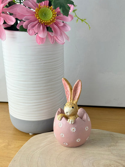 Jasper Rabbit sitting inside a pink daisy egg