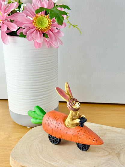 Jasper Rabbit sitting in a carrot car