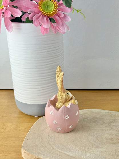 Jasper Rabbit sitting inside a pink daisy egg