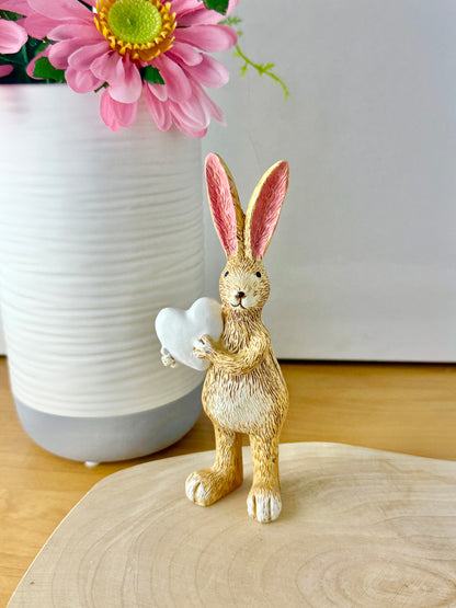 Jasper Rabbit holding a white heart