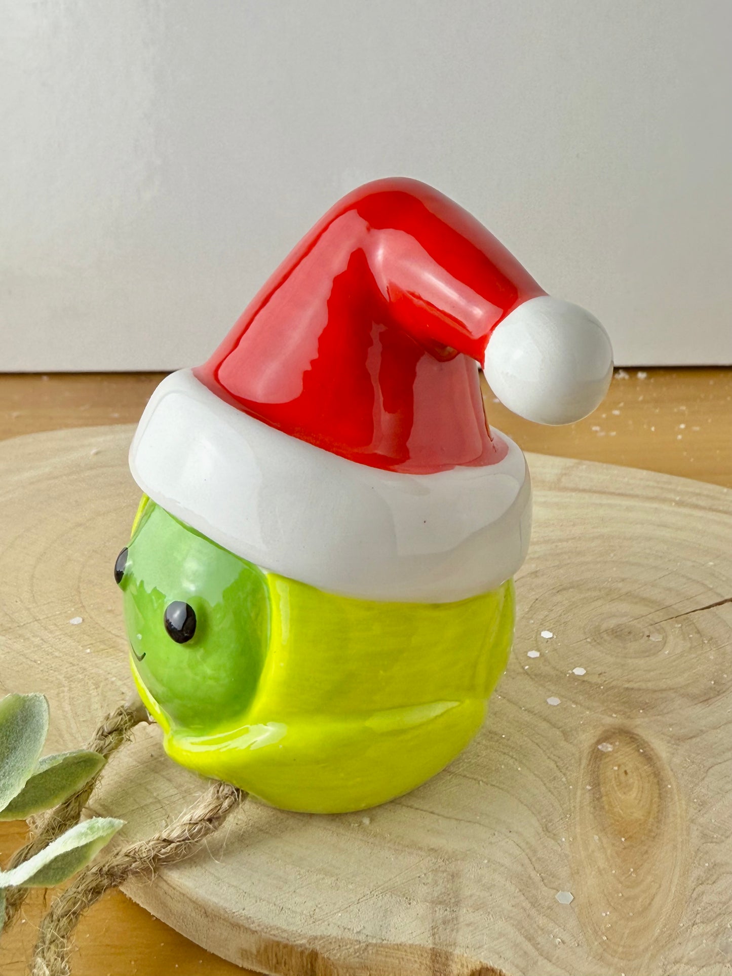 Green Sprout Shelf Sitter with dangley legs