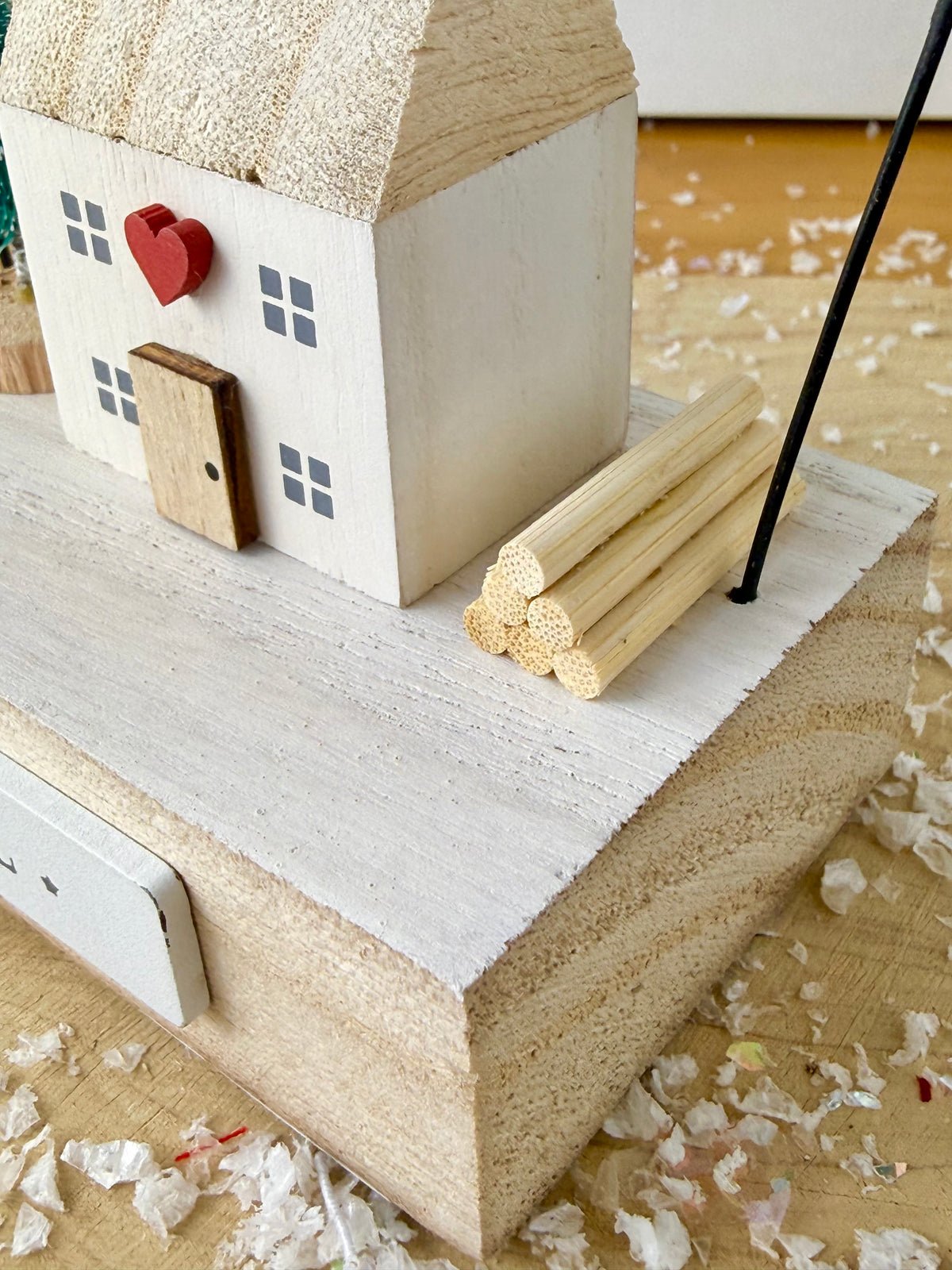 Wooden Noel House with bell arch