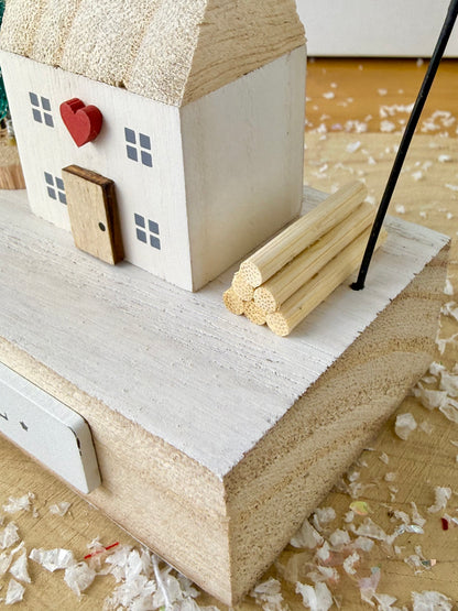 Wooden Noel House with bell arch