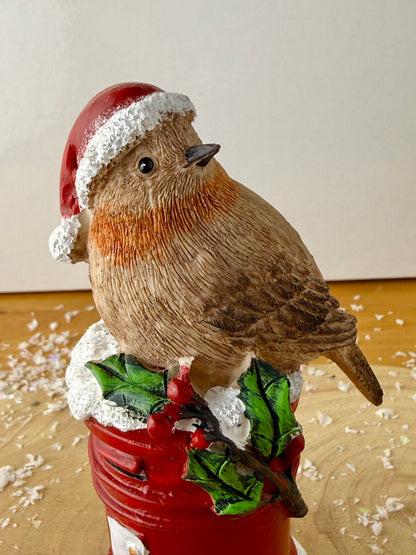 Robin sat on top of a Red Post Box