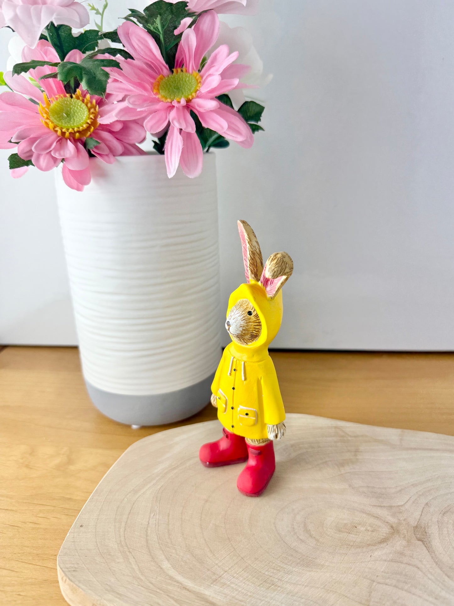 Jasper Rabbit dressed for the rain in a yellow raincoat & red wellies