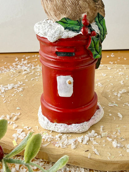 Robin sat on top of a Red Post Box