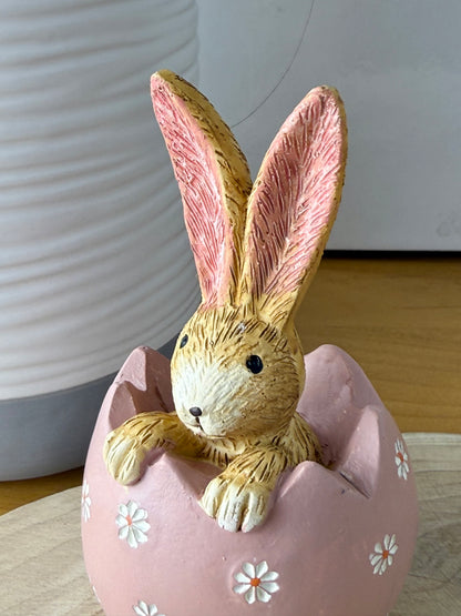 Jasper Rabbit sitting inside a pink daisy egg