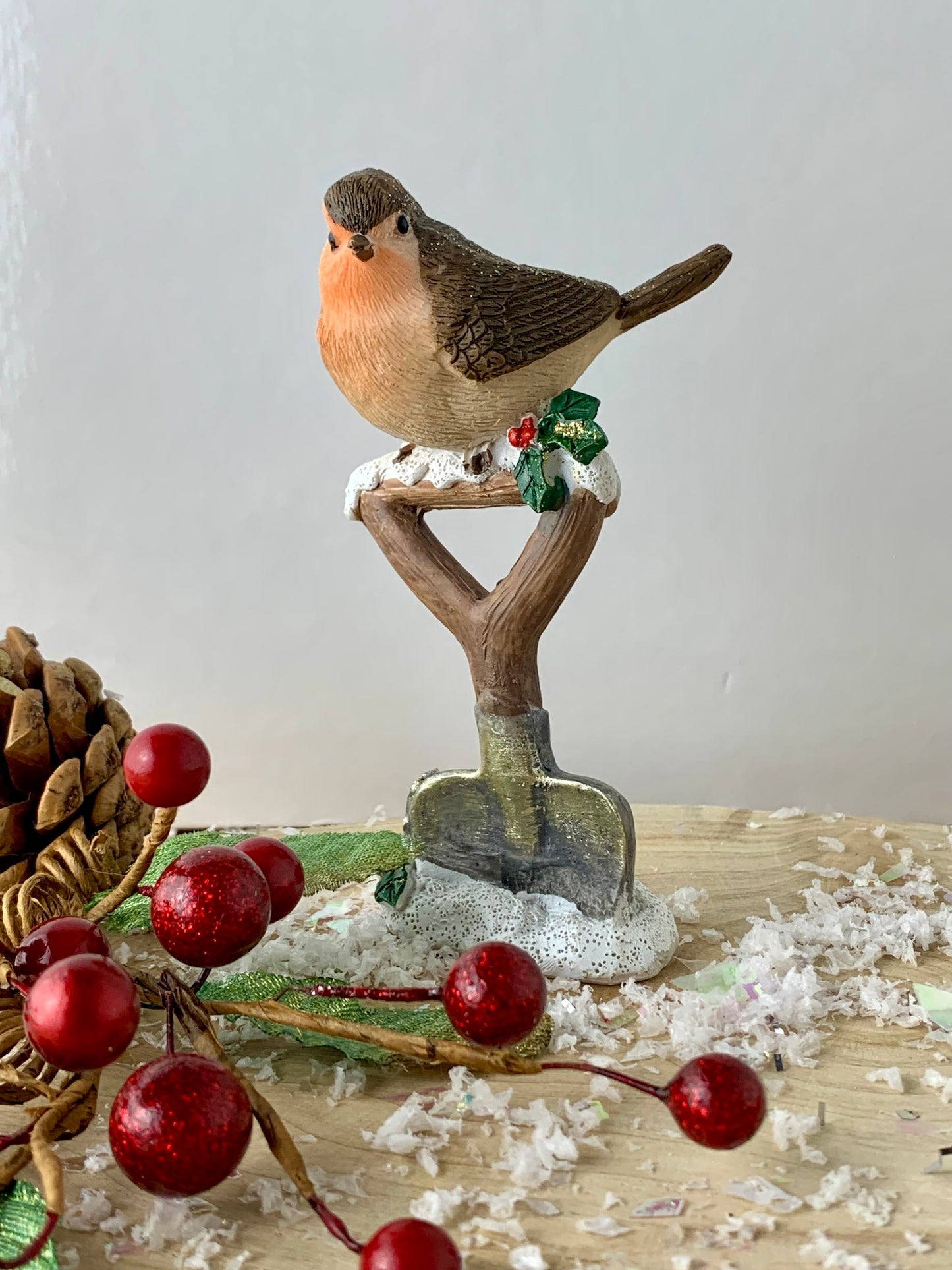 Christmas Robin sitting on a spade