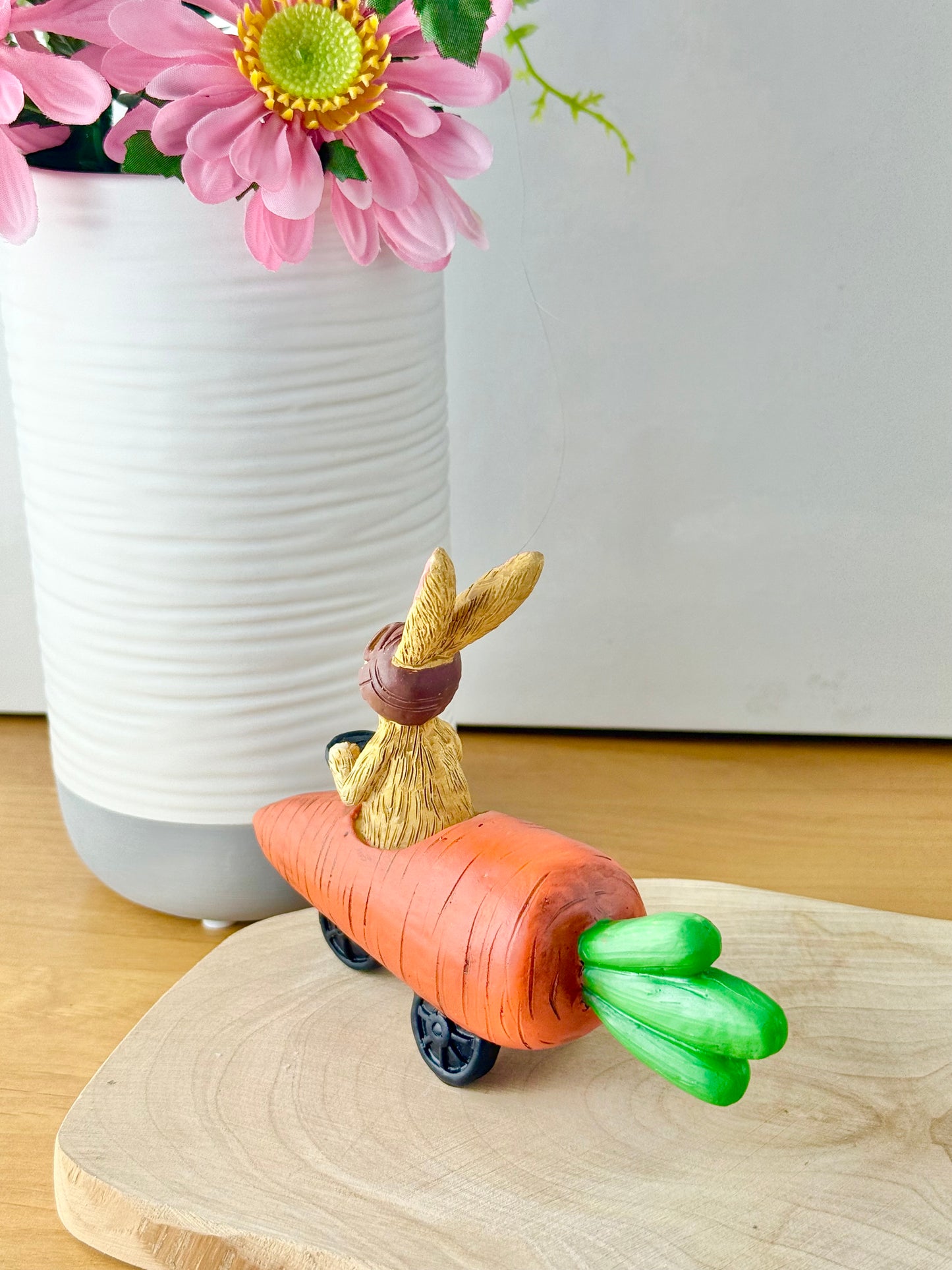 Jasper Rabbit sitting in a carrot car