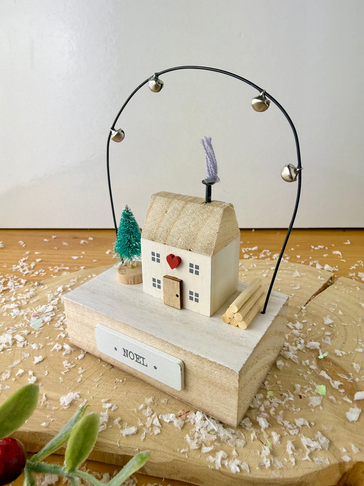 Wooden Noel House with bell arch