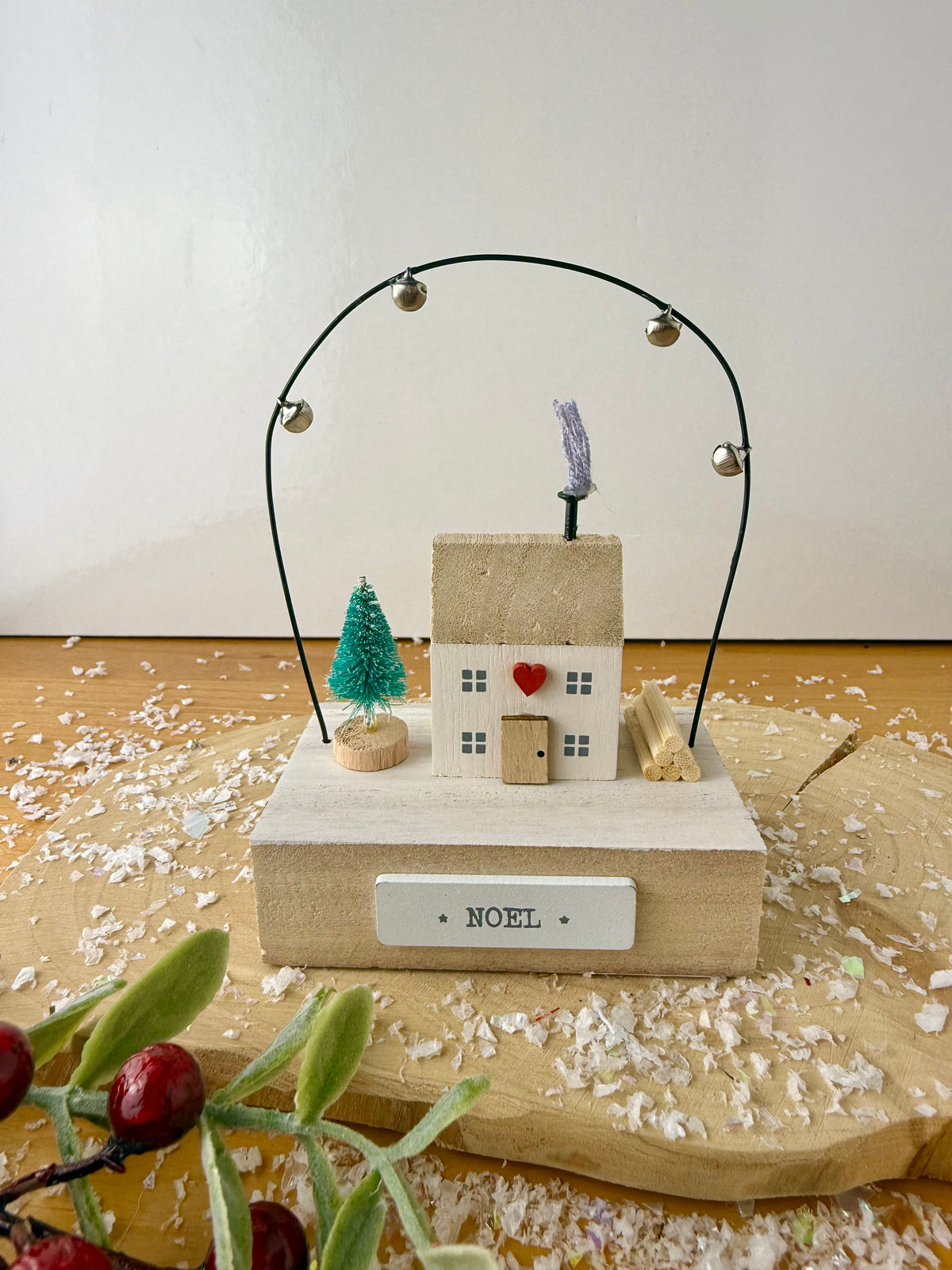 Wooden Noel House with bell arch