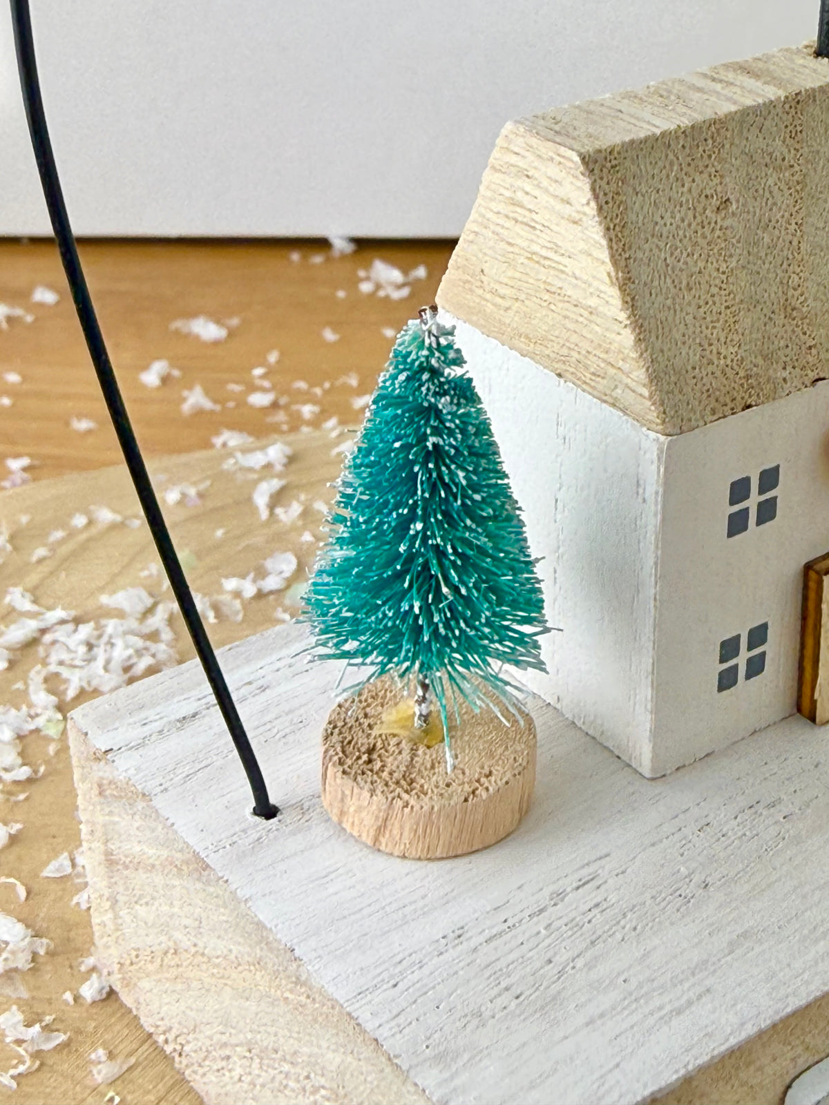 Wooden Noel House with bell arch