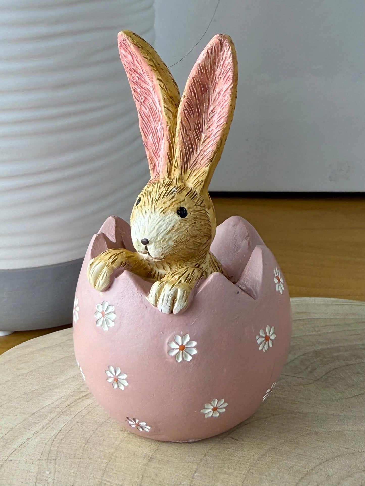 Jasper Rabbit sitting inside a pink daisy egg