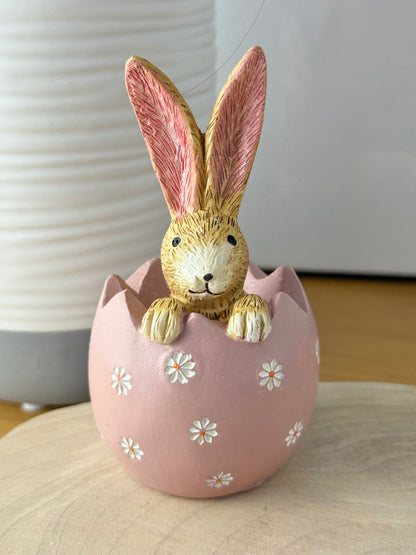 Jasper Rabbit sitting inside a pink daisy egg