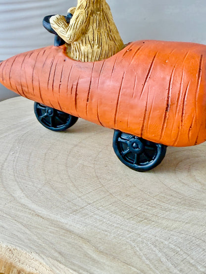 Jasper Rabbit sitting in a carrot car