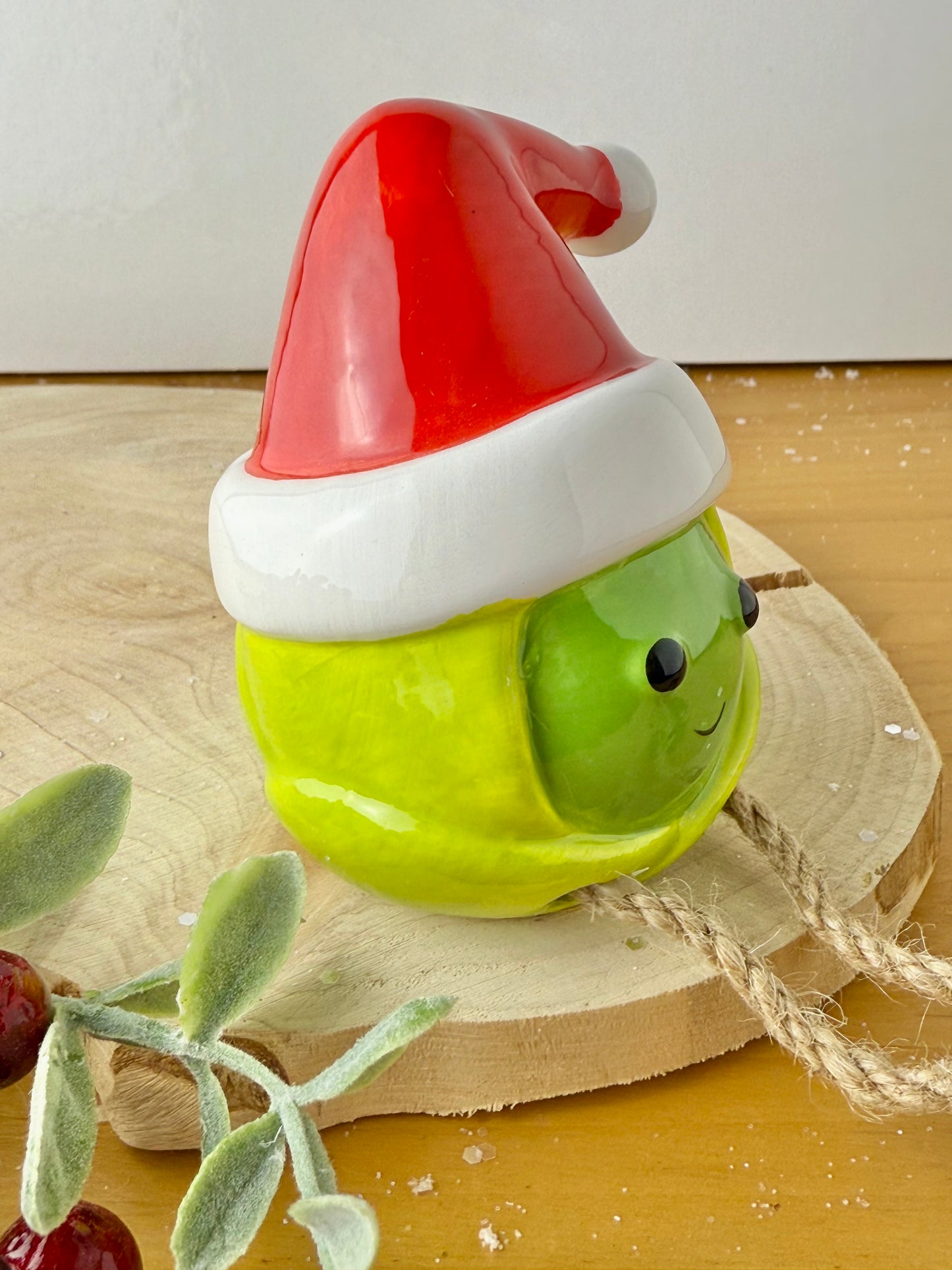 Green Sprout Shelf Sitter with dangley legs