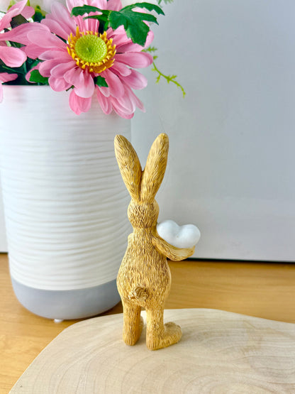 Jasper Rabbit holding a white heart
