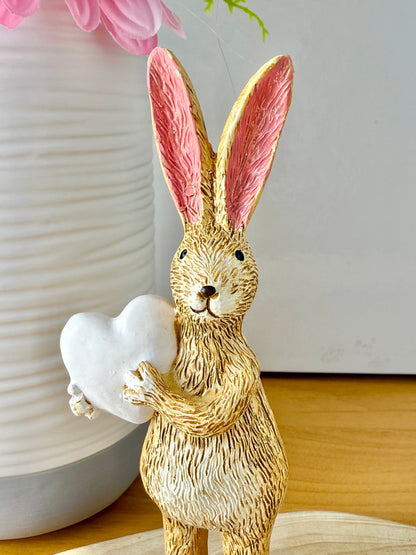 Jasper Rabbit holding a white heart